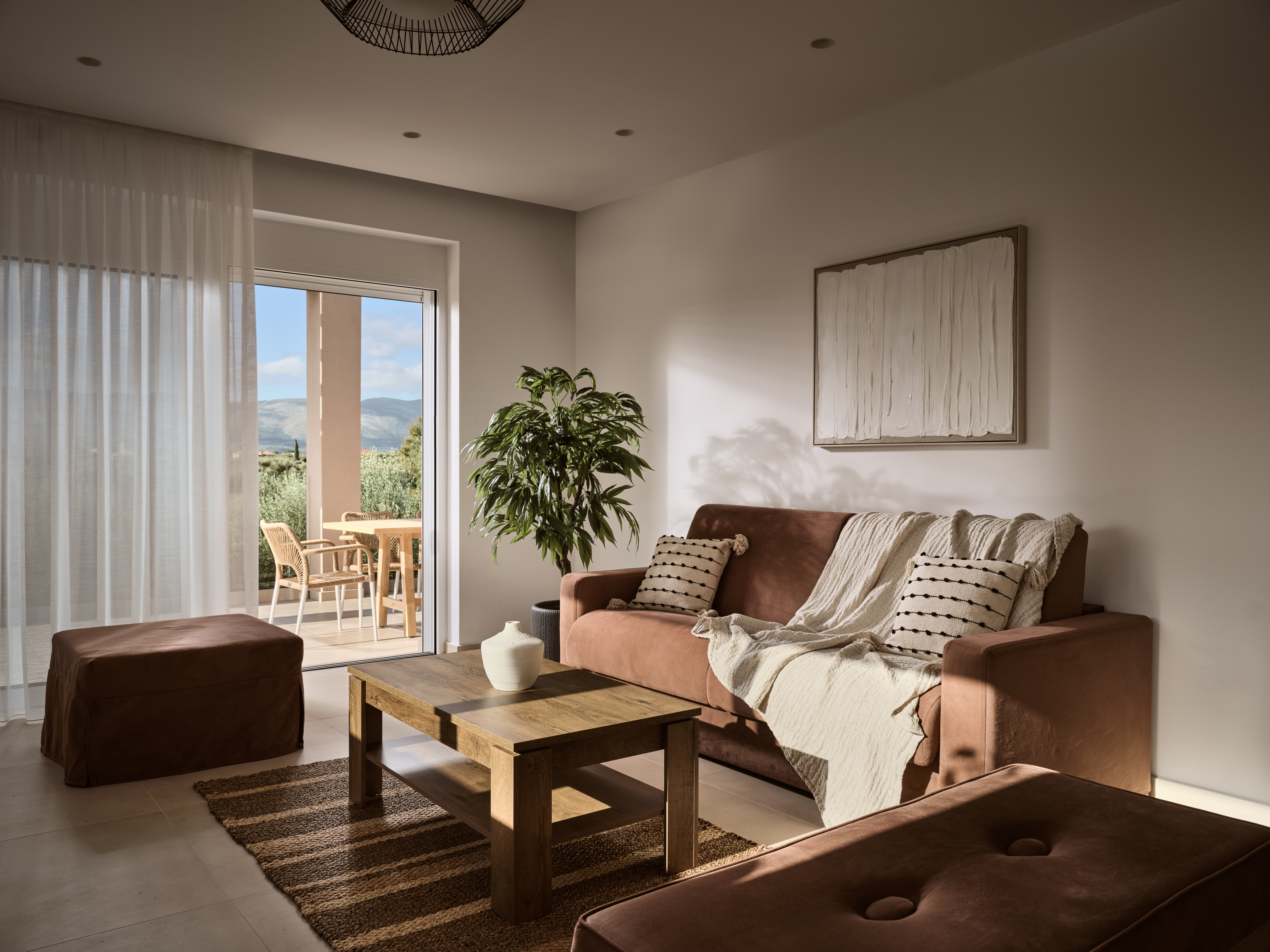 A collated and collected feel to the natural living-cum design, featuring a smart 55' TV.