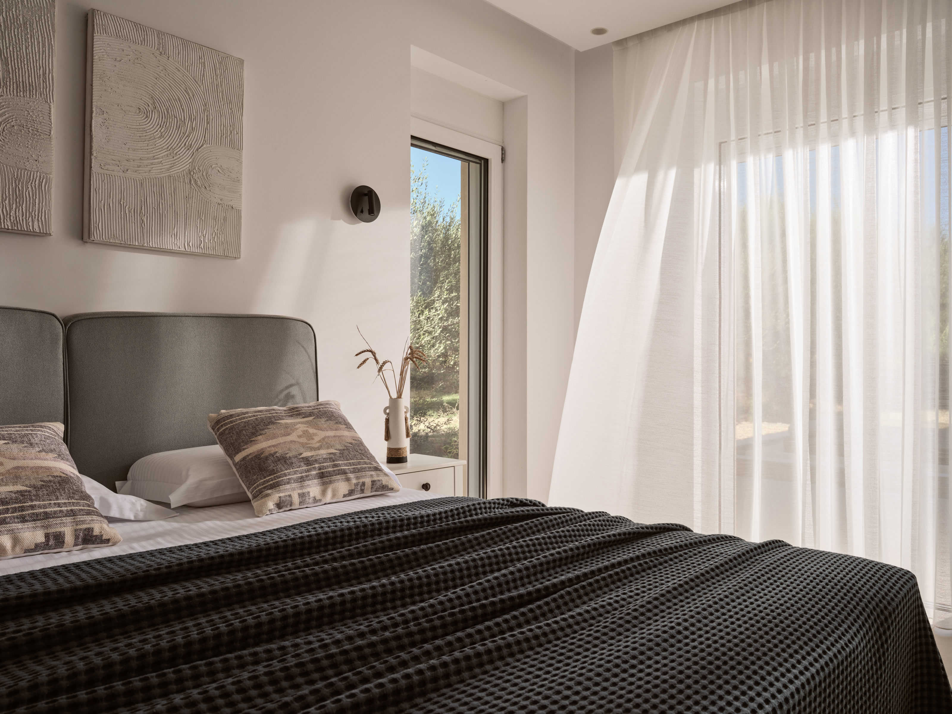 The elegant bedroom features only the softest linens.